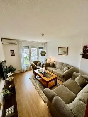 a living room with couches and a coffee table at Stan na dan Kej Una in Bosanska Dubica