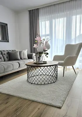 a living room with a couch and a coffee table at Apartment City View in Bihać