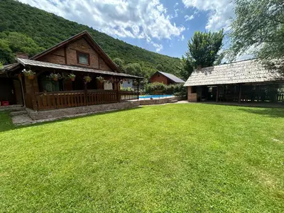 a large yard in front of a house with a building at 