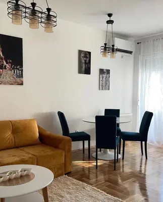a living room with a couch and a table at Stan 23 in Banja Luka