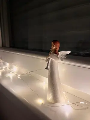 a plastic figurine of a woman sitting in a bath tub at Stan 23 in Banja Luka