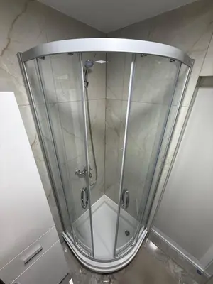 a shower with a glass enclosure in a bathroom at Luxapartman in Banja Luka