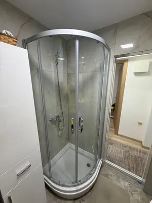 a shower with a glass enclosure in a bathroom at Luxapartman in Banja Luka