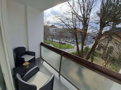 a balcony with chairs and a view of a tree at Stojanović Diwine in Banja Luka