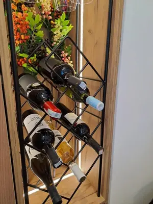 a bunch of wine bottles in a wine rack at Stojanović Diwine in Banja Luka
