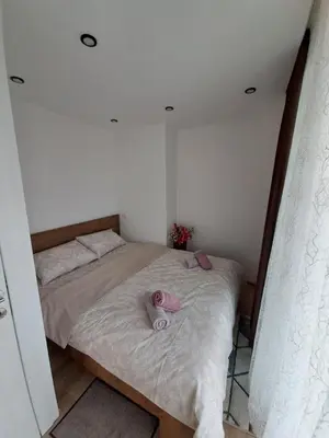 two beds in a bedroom with towels on them at Stojanović Diwine in Banja Luka