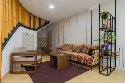 a living room with a couch and a table at Soba Kašmir in Bugojno