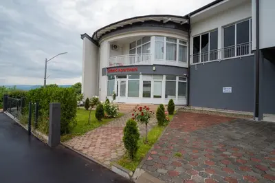 a building with a sign on the side of it at Soba Kašmir in Bugojno