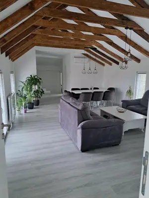 a living room with a couch and a table at Happy Vecation in Tuzla