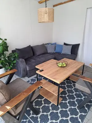 a living room with a couch and a table at Happy Vecation in Tuzla