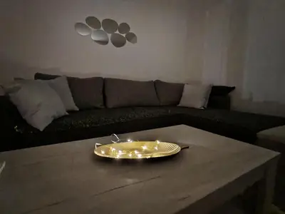 a tray with lights on a coffee table in a living room at Stan na dan Prnjavor in Prnjavor