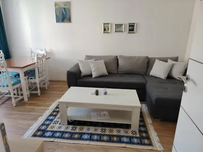 a living room with a couch and a coffee table at Stan na dan Prnjavor in Prnjavor