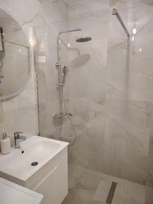 a bathroom with a shower and a sink at Stan na dan Prnjavor in Prnjavor