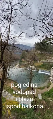 a view of a river with a waterfall at Apartman Heli Meli 1 in Jajce