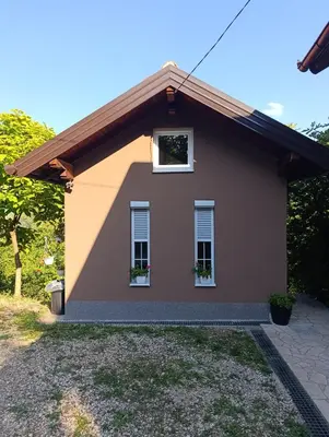a small house with a pitched roof at VA Apartments in Tešanj