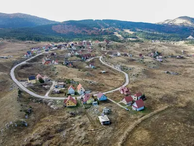an aerial view of a small village in a field at Apartman Lena in Kupres