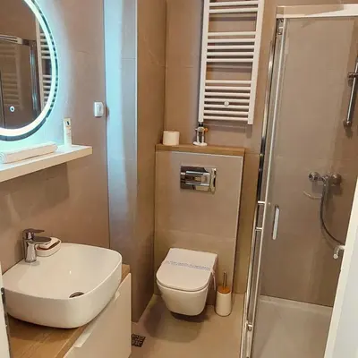 a bathroom with a toilet and a sink and a shower at Stan na dan Borik Banja Luka in Banja Luka