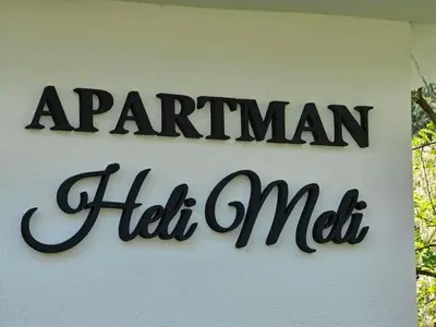 a sign for a manican half mall on a building at Apartman Heli Meli 2 in Jajce