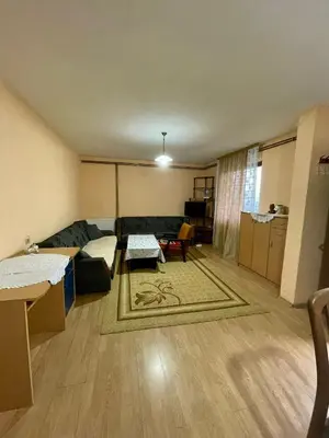 a living room with a couch and a table at Stan na dan Tomic in Rebrovac