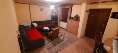a living room with a couch and a table at Stan na dan Tomic in Rebrovac