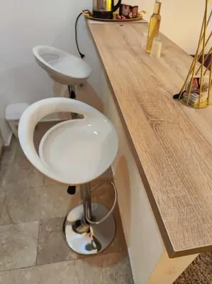 a bathroom with a white toilet and a counter at Apartman M&M in Travnik