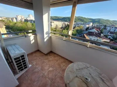 a balcony with a view of a city at Index Apartman in Banja Luka