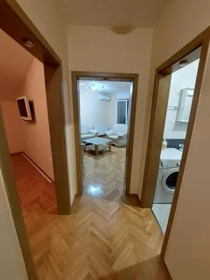 a view of a living room from a hallway at Index Apartman in Banja Luka