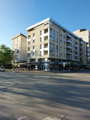 an empty street in front of a building at Index Apartman in Banja Luka