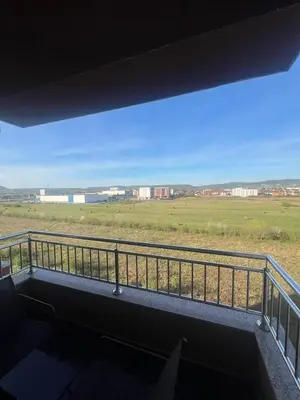 a view of a field from the balcony of a house at Una-No1 in Bihać