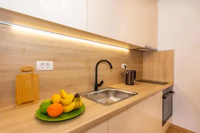 a kitchen with a plate of fruit on a counter at Apartman Krželj A4 in Livno