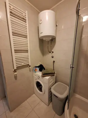 a small bathroom with a toilet and a sink at Apartman Sarah - Autobuska Stanica in Tuzla