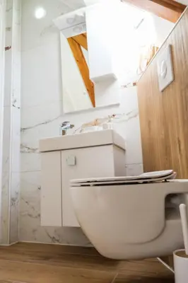 a bathroom with a toilet and a sink at Apartman Maja in Jajce