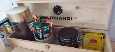 a wooden box filled with different types of food at Sole Tiny House in Šipovo
