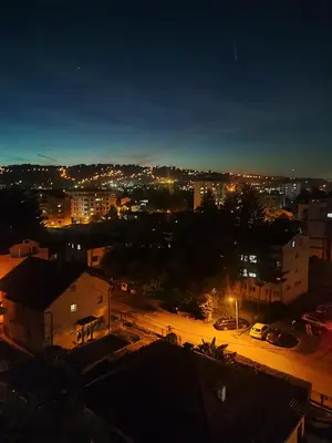 a view of a city at night with lights at Apartman 50 in Banja Luka