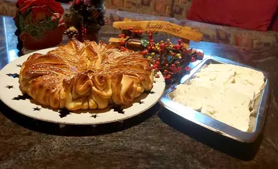 a table with a cake and a pan of cheese at Holiday Home Tirol in Vlasic