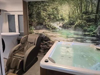 a jacuzzi tub in a bathroom with a mural at Villa Mia in Prnjavor