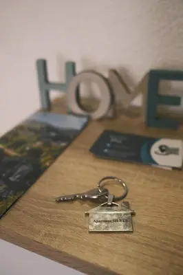 a key chain sitting on top of a table at Apartman Silver in Jajce
