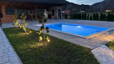 a swimming pool in the yard of a house at Villa LANA Krupa na Vrbasu in Banja Luka