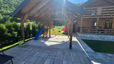 a pavilion with a playground with a slide at Villa LANA Krupa na Vrbasu in Banja Luka