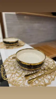 two plates and spoons are sitting on a table at Stan na dan sa dzakuzijem om relax in Prijedor