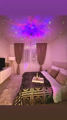 a bedroom with a large bed with a purple ceiling at Stan na dan sa dzakuzijem om relax in Prijedor