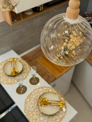 a table with two plates and glasses on it at Stan na dan sa dzakuzijem om relax in Prijedor