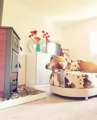 a living room with a couch and a tv at Pine Oasis in Zavidovići
