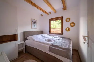a bedroom with a bed and a window at Sweet Home Visoko FREE PARKING, AC, RENT A CAR in Visoko