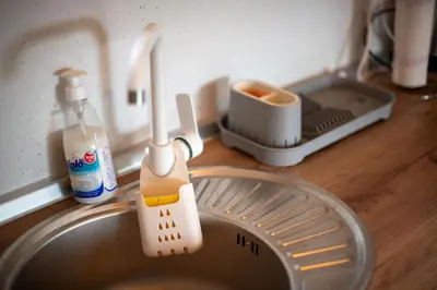 a kitchen sink with a dish drying rack and a whisk at Sweet Home Visoko FREE PARKING, AC, RENT A CAR in Visoko