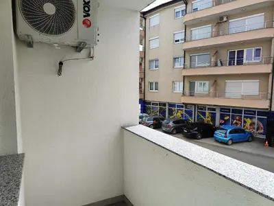 a room with a air conditioner on the side of a building at Apartmani Sanja in Teslić