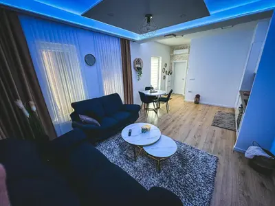 a living room with a couch and a table at Apartman Zdravko in Tomislavgrad