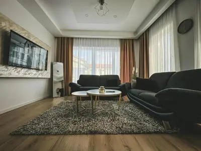 a living room with a couch and a table at Apartman Zdravko in Tomislavgrad