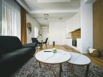 a living room with a couch and a table at Apartman Zdravko in Tomislavgrad