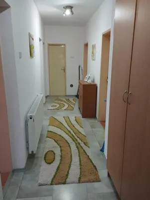 a hallway with a room with a rug on the floor at Apartman Unac in Drvar